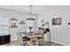 Farmhouse style dining room with chandelier and hardwood floors at 14610 Horse Trot Rd, Lithia, FL 33547