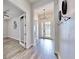 Bright entry hall with chandelier and hardwood floors at 14610 Horse Trot Rd, Lithia, FL 33547