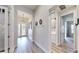 View down a hallway showcasing a laundry room and access to other rooms at 14610 Horse Trot Rd, Lithia, FL 33547