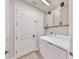 Clean laundry room with washer, dryer, and cabinets at 14610 Horse Trot Rd, Lithia, FL 33547