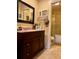 Bathroom with granite countertop and dark wood vanity at 14655 Pine Glen Cir, Lutz, FL 33559