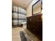 Bathroom with shower/tub combo and dark wood vanity at 14655 Pine Glen Cir, Lutz, FL 33559