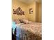 Bedroom with a queen-size bed and wall decor at 14655 Pine Glen Cir, Lutz, FL 33559