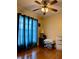 Bright bedroom with hardwood floors and blue curtains at 14655 Pine Glen Cir, Lutz, FL 33559