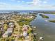 Aerial view of waterfront home with private pool and dock at 1538 Riverside Dr, Tarpon Springs, FL 34689