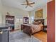 Comfortable bedroom with hardwood floors and built-in shelving at 1538 Riverside Dr, Tarpon Springs, FL 34689