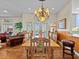 Elegant dining room with chandelier and ornate dining table at 1538 Riverside Dr, Tarpon Springs, FL 34689