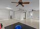 Spacious exercise room with ceiling fans and tiled floors at 1538 Riverside Dr, Tarpon Springs, FL 34689