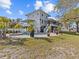 Two-story home with wrap around porch and pool at 1538 Riverside Dr, Tarpon Springs, FL 34689