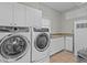 Laundry room with front load washer and dryer at 1538 Riverside Dr, Tarpon Springs, FL 34689