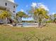 Landscaped backyard with pool and spa at 1538 Riverside Dr, Tarpon Springs, FL 34689