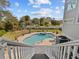 Steps leading down to a kidney-shaped pool at 1538 Riverside Dr, Tarpon Springs, FL 34689