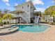 Backyard oasis with pool, spa, and large home at 1538 Riverside Dr, Tarpon Springs, FL 34689