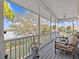 Peaceful porch overlooking the water with seating area at 1538 Riverside Dr, Tarpon Springs, FL 34689