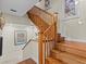 Wooden staircase with classic design and wall art at 1538 Riverside Dr, Tarpon Springs, FL 34689