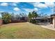 Large backyard with grassy area and screened enclosure at 1621 Park N St, St Petersburg, FL 33710