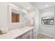 Modern bathroom with a quartz vanity and a large mirror at 1621 Park N St, St Petersburg, FL 33710