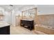 Bright bathroom with a dark vanity, granite countertop, and tile flooring at 1621 Park N St, St Petersburg, FL 33710