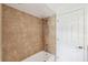 Clean bathroom with tan tile and a shower/tub combo at 1621 Park N St, St Petersburg, FL 33710