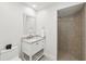 Small bathroom with white vanity, shower, and tile flooring at 1621 Park N St, St Petersburg, FL 33710