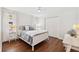 Spacious bedroom with hardwood floors and white furniture at 1621 Park N St, St Petersburg, FL 33710