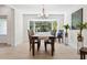 Bright dining room with hardwood floors and a large bay window at 1621 Park N St, St Petersburg, FL 33710