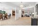 Open concept dining area with hardwood floors, chandelier, and view into kitchen and living room at 1621 Park N St, St Petersburg, FL 33710