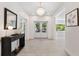 Bright entryway with hardwood floors, chandelier and console table at 1621 Park N St, St Petersburg, FL 33710