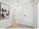 Bright entryway with wood-look flooring and a palm tree print at 1621 Park N St, St Petersburg, FL 33710