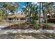 Landscaped front yard of a single-story home with a circular driveway at 1621 Park N St, St Petersburg, FL 33710