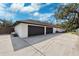 Three-car garage with modern dark brown doors at 1621 Park N St, St Petersburg, FL 33710