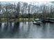 Lakefront property with private boat dock and house at 16320 Rock Lake Dr, Odessa, FL 33556