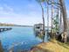 Private boat dock with covered boathouse on the lake at 16320 Rock Lake Dr, Odessa, FL 33556