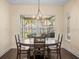 Bright dining area with lake view, chandelier and wooden table at 16320 Rock Lake Dr, Odessa, FL 33556