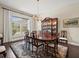 Formal dining room with large window, chandelier and hardwood floors at 16320 Rock Lake Dr, Odessa, FL 33556