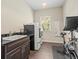 Laundry room with utility sink, exercise bike and washer/dryer at 16320 Rock Lake Dr, Odessa, FL 33556