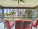 Relaxing screened porch with lake view and comfortable seating at 16320 Rock Lake Dr, Odessa, FL 33556