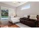 Cozy bedroom with a sliding glass door to the pool area and a comfortable seating area at 1642 Daylily Dr, Trinity, FL 34655