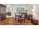 Dining room with wood floors, large window, and a hutch at 1642 Daylily Dr, Trinity, FL 34655