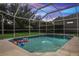 Spacious pool with outdoor green space to enjoy a relaxing evening at 1642 Daylily Dr, Trinity, FL 34655