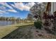 Peaceful backyard oasis with lake view and lush landscaping at 170 Eric Ct, Oldsmar, FL 34677