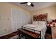 Bright bedroom with a queen bed, large closet, and wood-look floors at 170 Eric Ct, Oldsmar, FL 34677