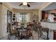 Dining area with glass-top table, chairs, and access to patio at 170 Eric Ct, Oldsmar, FL 34677