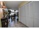 View down a hallway with coat closet and glimpse of living area at 170 Eric Ct, Oldsmar, FL 34677