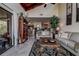 Living room features high ceilings, a bookcase, and views of the outdoors at 170 Eric Ct, Oldsmar, FL 34677