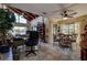 Living room with vaulted ceiling, water view, and seating area at 170 Eric Ct, Oldsmar, FL 34677