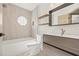 Modern bathroom featuring a floating vanity and updated fixtures at 1741 Spinning Wheel Dr, Lutz, FL 33559