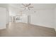 Open concept living room with wood-look floors and high ceilings at 1741 Spinning Wheel Dr, Lutz, FL 33559