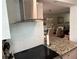 Stainless steel range and granite countertop in updated kitchen at 1799 N Highland Ave # 38, Clearwater, FL 33755