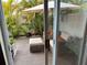 Private patio with seating and umbrella at 1799 N Highland Ave # 38, Clearwater, FL 33755